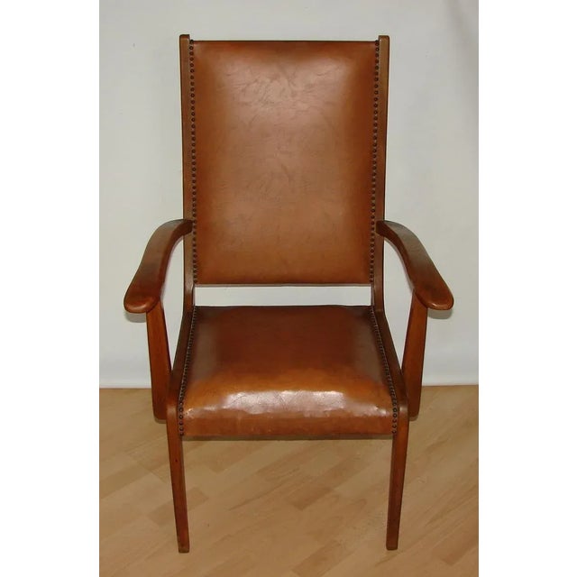 - Modern armchair from the 1950s - The chair is made of beech wood - Upholstery made of ecological leather - The seat is...