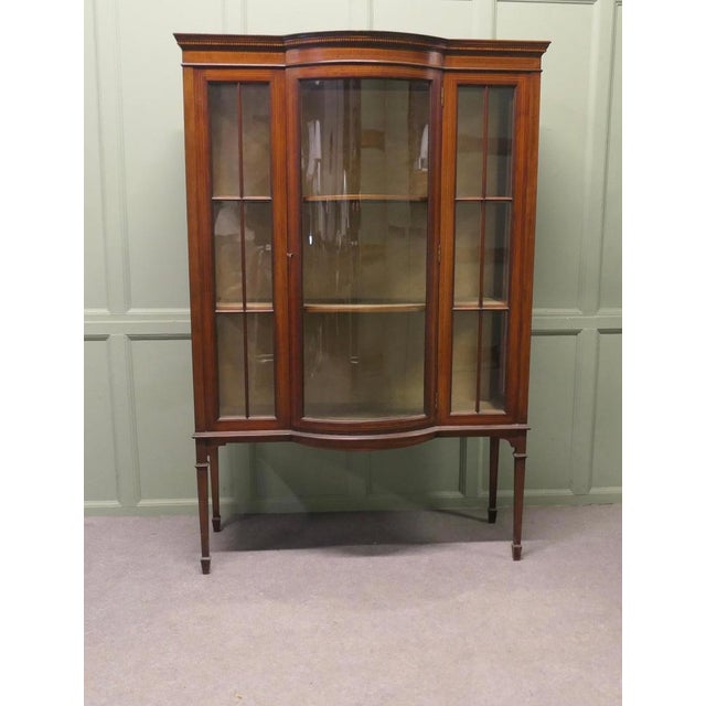 Tall Edwardian Bow Front Glazed Display Cabinet This is a very attractive piece, it has a beautiful curved glass glazed...