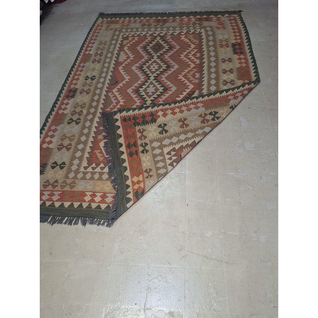 Boho Chic Vintage Handwoven Kilim Rug – 5’7” X 8’5” | Geometric Tribal Design | Earth-Tone Wool Flatweave For Sale - Image 3 of 5