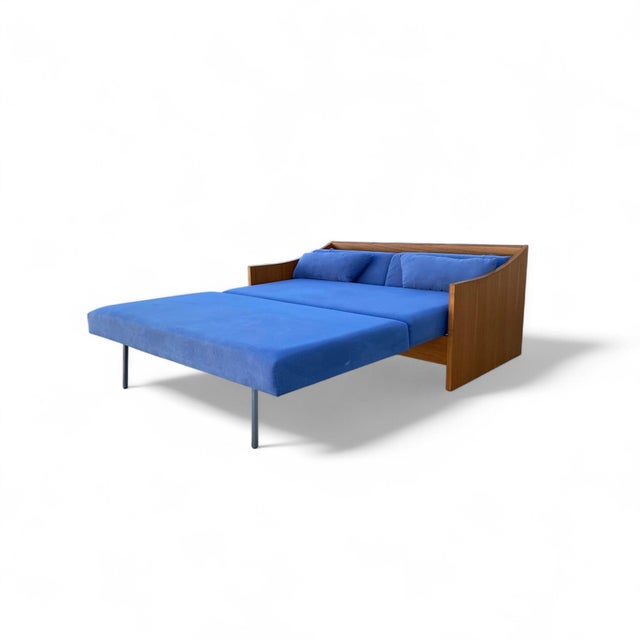 1970s Canadian Teak Pull-Out Sofa Bed in Blue Upholstery. A Canadian mid-century teak sofa bed with blue upholstered...