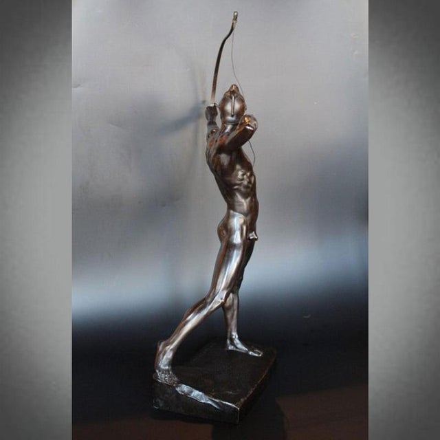 The archer , a bronze figure by ernst moritz geyger (1861-1941), depicting a muscular young archer in full aim. Wonderful...
