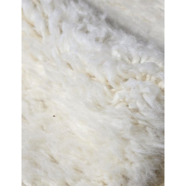 Modern Abstract Moroccan Rug – Handmade Berber Wool Carpet This artistic handmade Moroccan rug features a soft ivory...