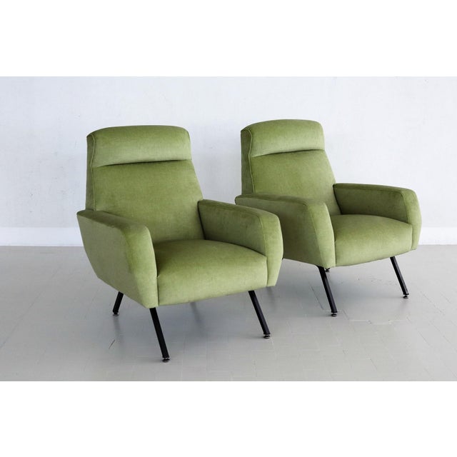 A set of two beautiful and very comfortable Italian Midcentury armchairs or lounge chairs from the 1960s. The have been...