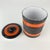 Nice vintage pottery canister with lid. Love the texture and orange and brown stripes. Made in Italy. Signed on bottom....