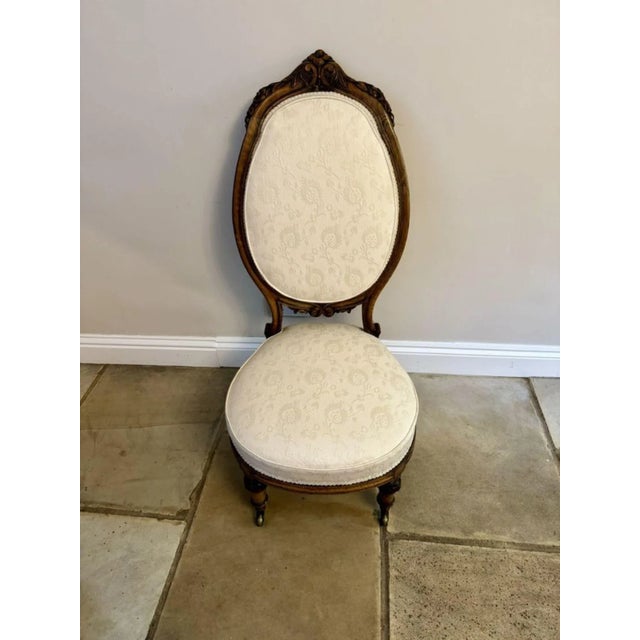 Beautiful quality antique Victorian carved walnut ladies chair, having a quality carved walnut shaped back with beautiful...