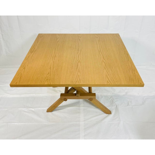 A refined and architecturally striking “Leonardo” square dining table by Morelato – Ebanisteria Italiana, designed and...