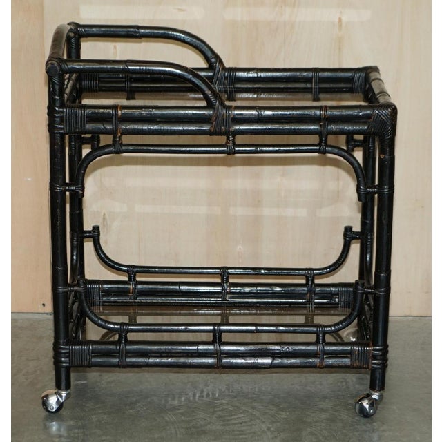 We are delighted to offer this very fine, circa 1950’s Mid Century Modern Bamboo and glass Chinese drinks trolley A good...