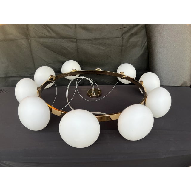 A CB2 exclusive. This stunning (dimmable) chandelier glows in a room in with warm radiance. Designed in Italy by Veronica...