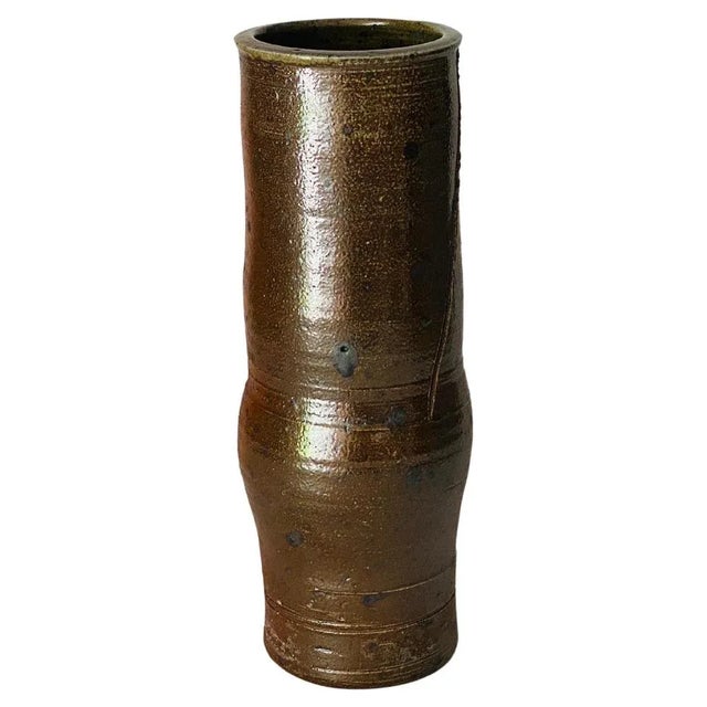 This is a vintage Vase, in Sandstone, from the well known Workshop, "La borne". In a brown color, this vase has been made...