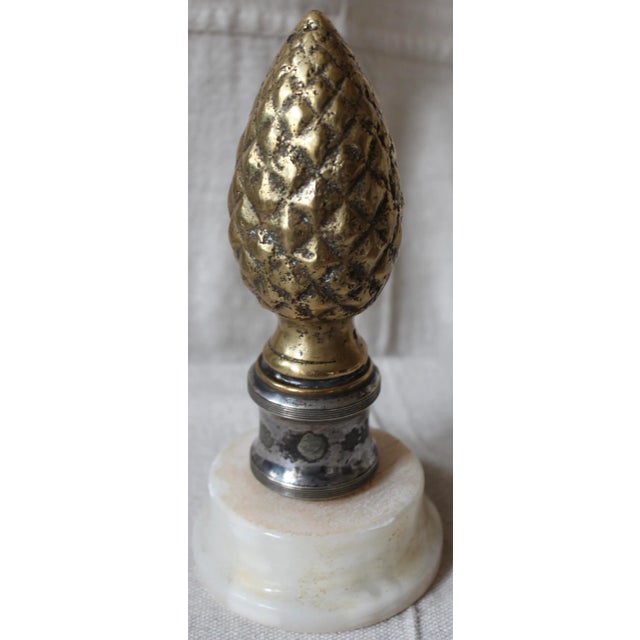An artichoke form finial from the late 19th or early 20th century. An alabaster base was added later for display purposes.