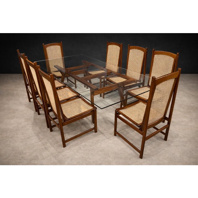 This refined set of eight dining chairs, produced by Celina Decorações in the 1960s, reflects the restrained elegance that...