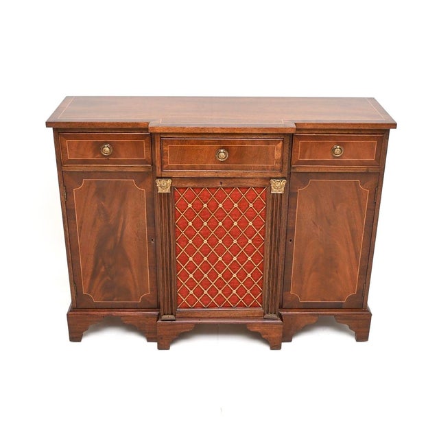 An impressive and very well made antique Georgian style grill front sideboard. This was made in England, it dates from...