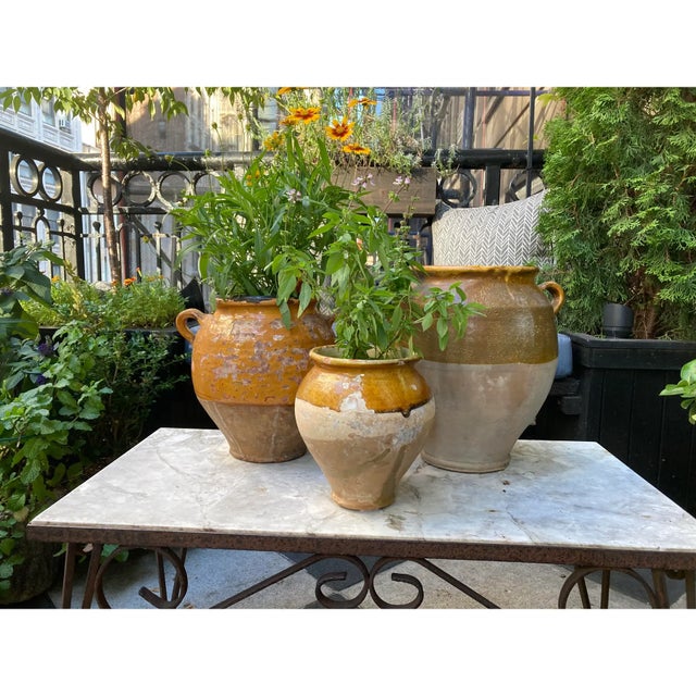 Wonderful set of three 19th century French terra cotta confit pots. The set is in great condition with lovely aged patina....