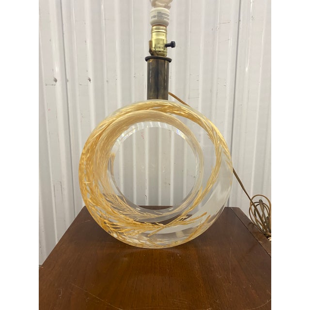 French-designed table lamp from the 20th century, likely dating to the 1970s. It features a distinctive sculptural base...