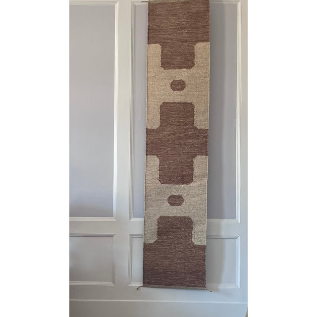 Inspired by the serene geometry of Villa Skärtofta, these handwoven tapestries are crafted in wool and flax, dyed with...