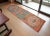 Woven in the 1960s in the Southeastern Anatolia region of Turkey, this extraordinary runner rug stands as a gallery-...