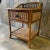 Bamboo & cane bedside table with 1 drawer and lower shelf wicker covers the top , shelf and sides. Wicker gallery around...