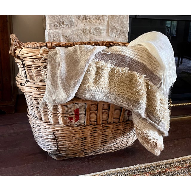 Imported from France. Early 20th century woven wicker basket. Used in the champagne regions of France when harvesting...
