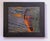 Fireside presents a striking portrait that captures the interplay of light and shadow, with warm hues illuminating the...