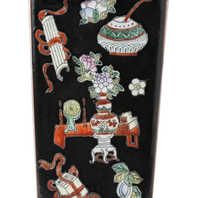 Chinese Famille Noir porcelain vase. Famille Noire "black family" refers to porcelain with a black background. The vase is...