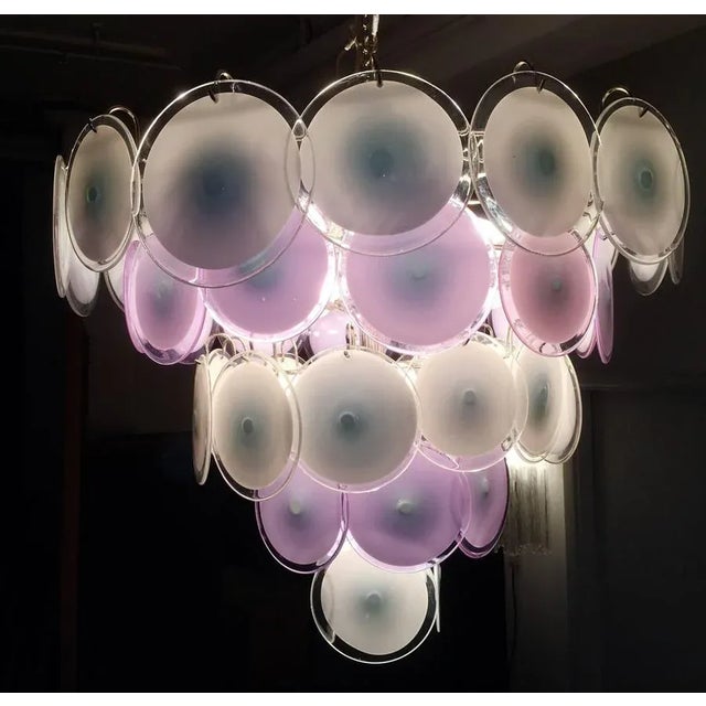 Spectacular chandelier by Vistosi made of 50 Murano discs white and violet put on five floors. This piece is attributed to...