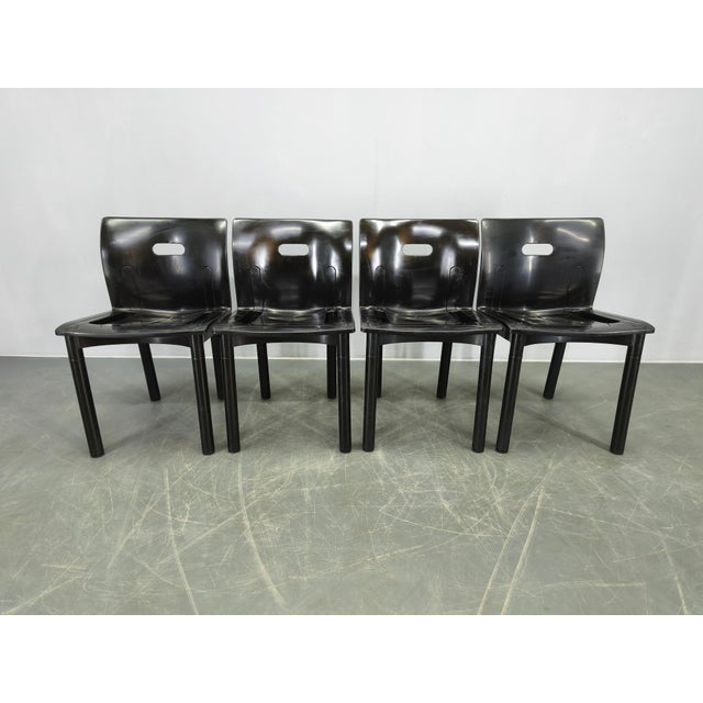 Set of four dining chairs designed by Anna Castelli Ferrieri and produced by Kartell, Italy, during the 1980s. The model...