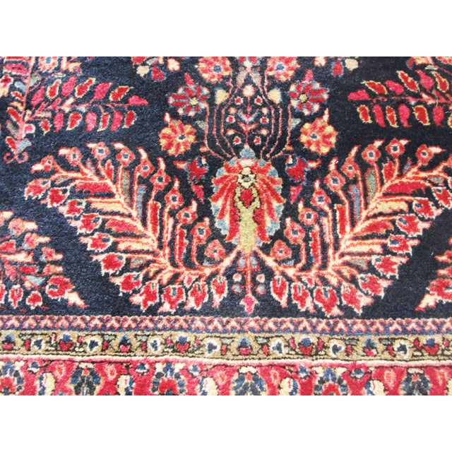 This exceptional antique Persian Mohajeran Sarouk rug, measuring approximately 3'5" x 4'11" and dating to around 1920, is...