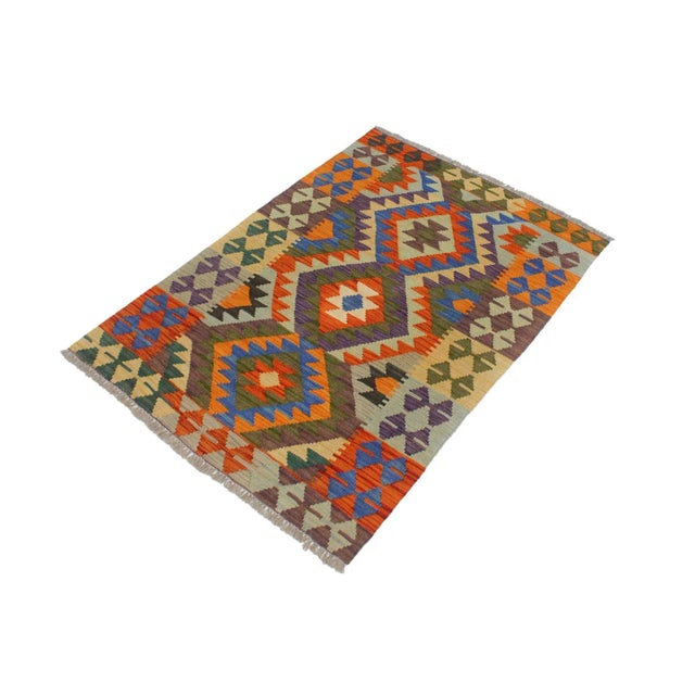 Add a touch of elegance to your home with this casual chic hand woven Tribal Kilim wool rug. Constructed on a loom by...