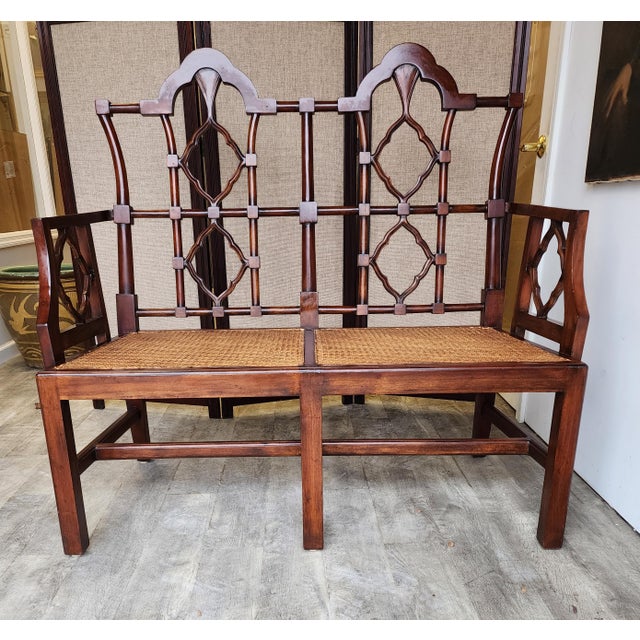 Distinctive mahogany bench seat or settee hand-crafted in the classic Chinese Chippendale taste. The bench features a...