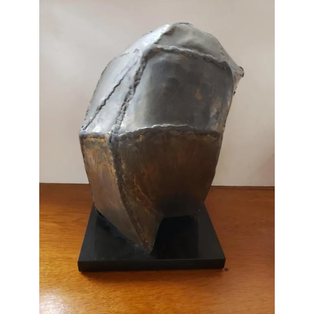 This Mid 20th Century Crying Israeli Woman in Veil Welded Copper Sculpture on Granite Base, attributed to Dorothy Robbins...