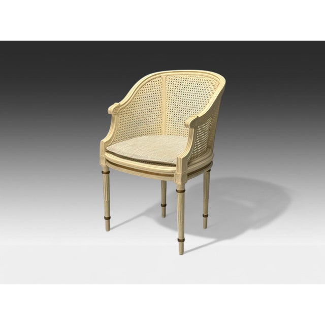 Louis XVI Style, Barrel Back Occasional Chair, Cream Painted Wood, Cane, 1960s Cream Painted Wood, Cane; USA, 1960s...