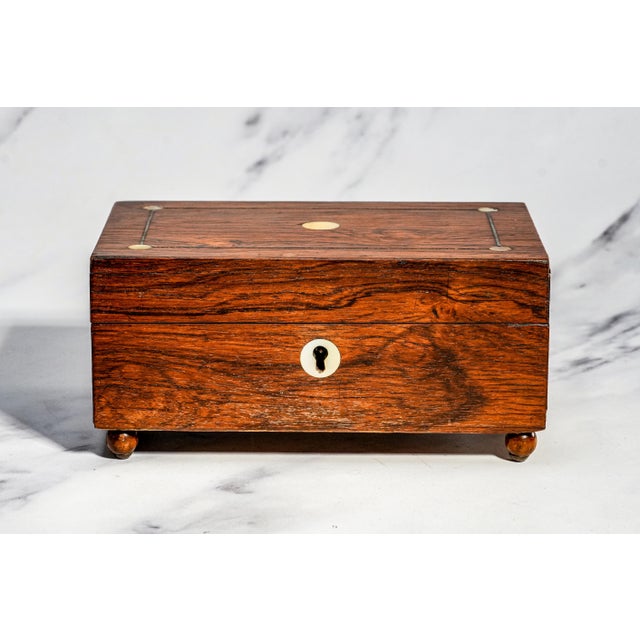 A charming example of Victorian craftsmanship, this antique jewelry box dates to approximately 1870 and embodies the...