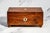 A charming example of Victorian craftsmanship, this antique jewelry box dates to approximately 1870 and embodies the...