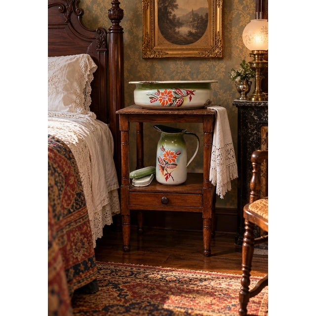 This is a two-tier wooden wash stand featuring a rectangular top, turned legs with ring and spool details, and a single...