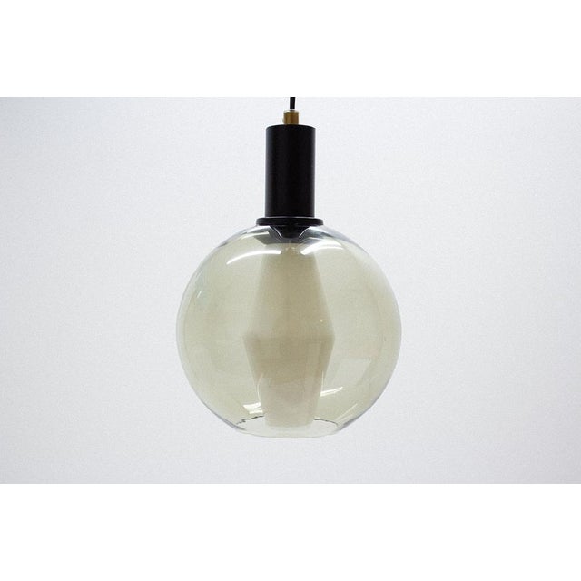 Hanging lamp designed by Tapio Wirkkala in Finland during the late 1950s. This actual pendant has been manufactured by...