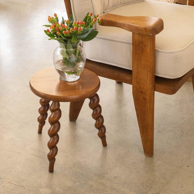 Vintage short wood stool with beautiful twisted wood legs and circular seat from France. Original wood finish with great...