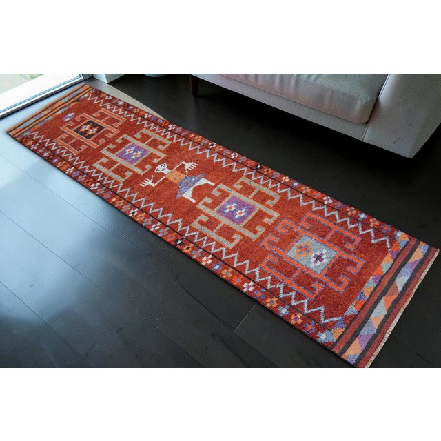Woven on a traditional village loom in the Mesopotamian region of Southeastern Anatolia, this striking 1960s runner...