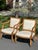 Pair of neoclassical style armchairs believe to be by Hickory chair. Medium-tone wood frame with subtly carved details...
