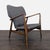 Relax in style with this lounge chair featuring a classic mid-century modern design. The sturdy wooden frame offers...