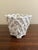 An elegant trompe l'oeil porcelain cachepot crafted in the form of a handwoven rope basket. Executed in glossy white...