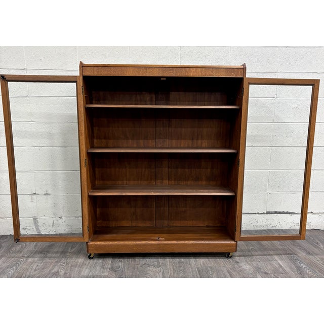 This is a stunning antique Victorian or Arts and Crafts golden oak double display cabinet, book shelf, bookcase, hall...