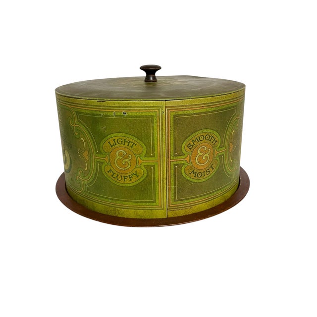 Add a touch of whimsy to your kitchen decor with this metal cake saver carrier by Ballonoff in a retro green weathered...