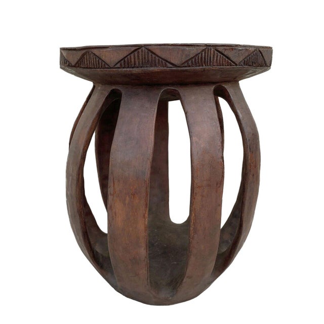 Superb hand-carved stool crafted from a single piece of wood by the Baga people of Guinea-Bissau. While masks and serpent...