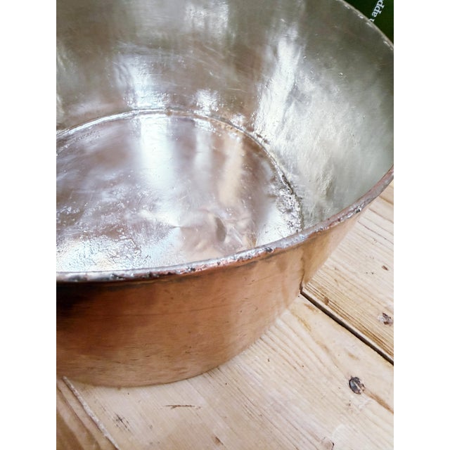 A stunning antique circa 1890s to very early 1900s heavy hammered copper pot with tin lining and a riveted iron handle,...