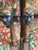 An exceptional pair of antique Louis XIII-style carved walnut fauteuils featuring rare and expressive figural mask arm...