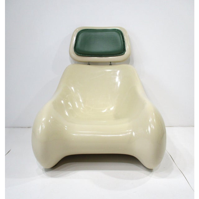 A very well crafted molded plastic sculptural Space Age Targa lounge chair with matching ottoman making it very...