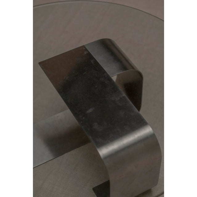 A sculptural and iconic Space Age coffee table designed by François Monnet, embodying the experimental spirit and forward-...