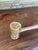 This vintage rawhide mallet features a cylindrical rawhide head secured with screws to a smooth, turned wooden handle. The...