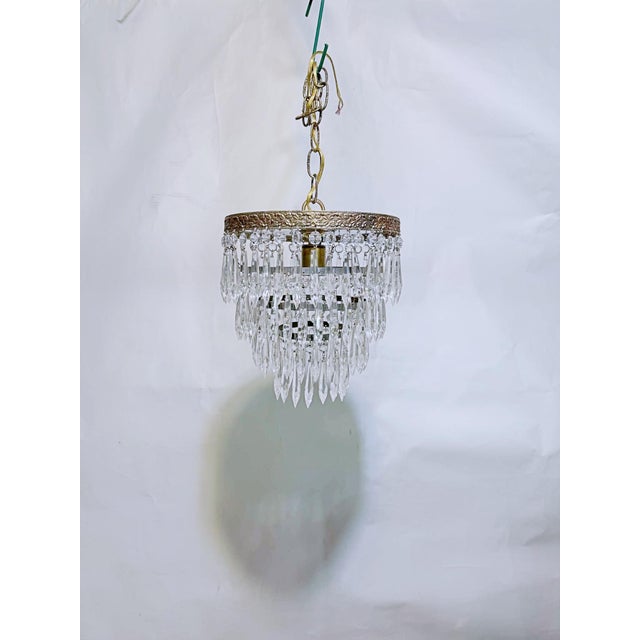 Elevate your space with this captivating mid-century Italian-style tiered waterfall chandelier. Designed with a striking...