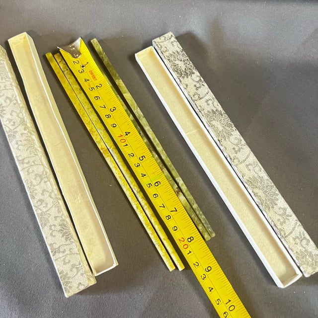 A rare and tactile set of mid-century Chinese chopsticks carved from solid nephrite jade, accompanied by their original...